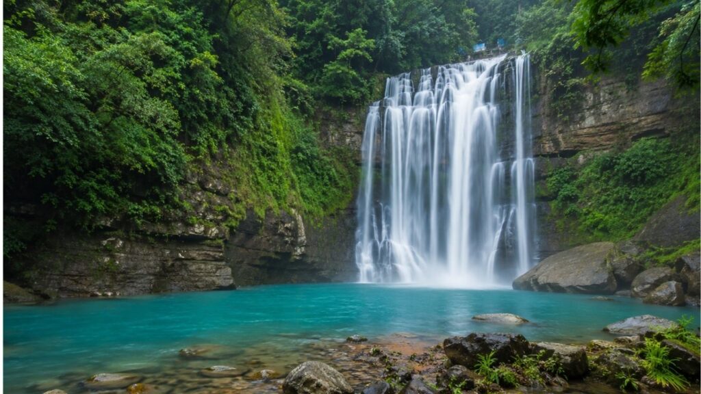 Monsoon in Meghalaya 2026,
Krang Suri Falls, Krang Suri Falls in Meghalaya surrounded by lush green forests during the monsoon,