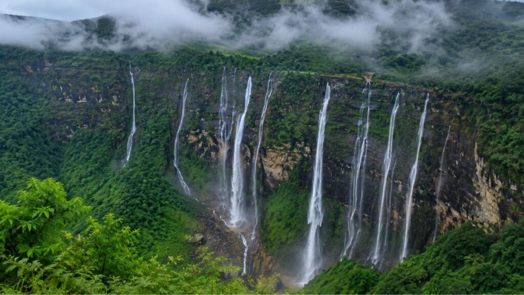 Monsoon in Meghalaya 2026,
Seven Sisters Falls, Seven Sisters Falls surrounded by misty hills in Cherrapunji, Meghalaya,